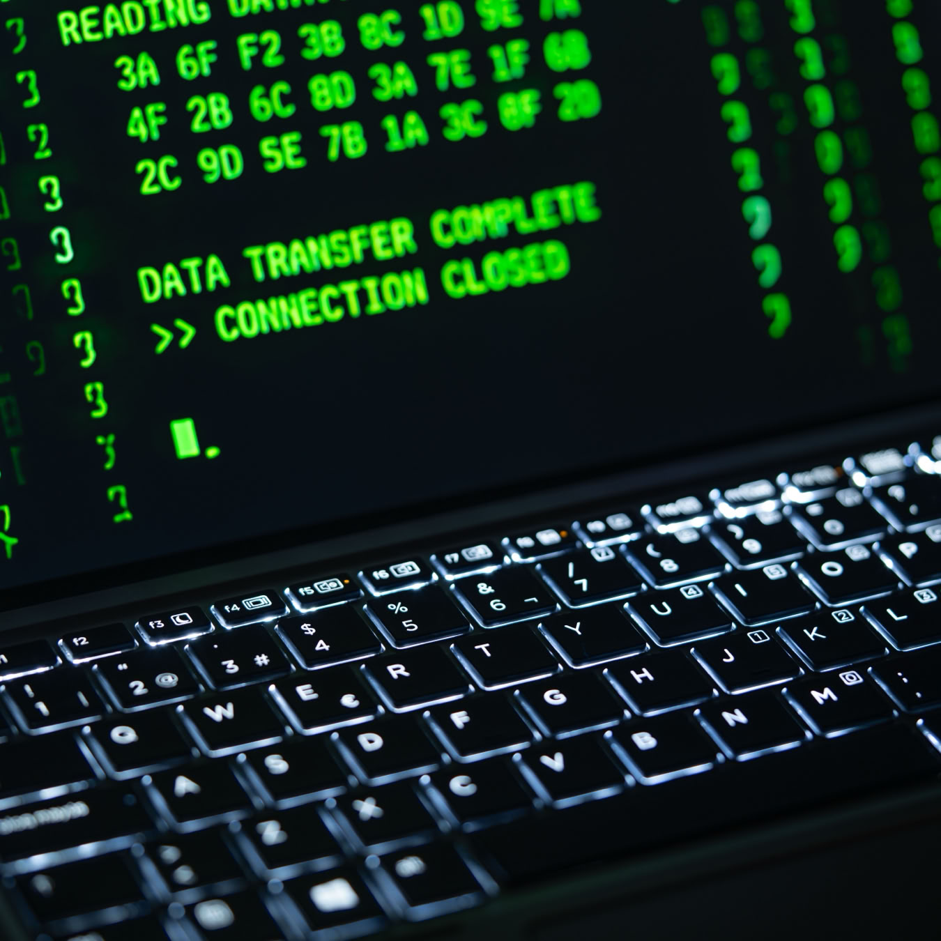 Close-up of a laptop screen displaying green code text. Perfect for cybersecurity themes.